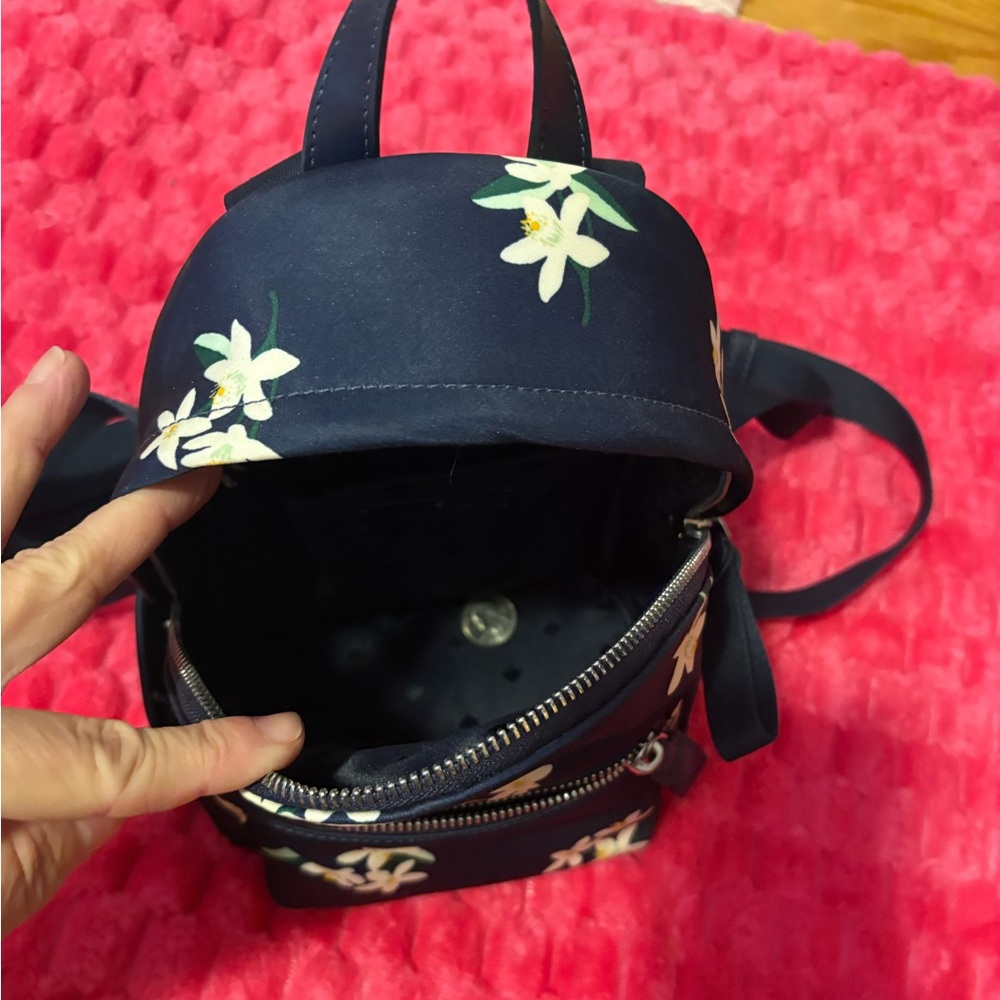 Kate Spade Navy Backpack with White Floral Design